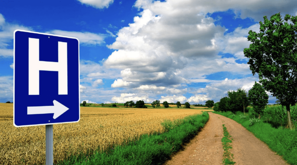 photo of a hospital directional sign on a rural road